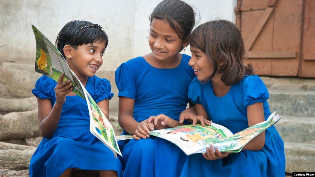 Children in Bangladesh with books supplied by Room to Read. (Room to Read) 
