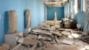FILE - This file photo released March 27, 2016, by the Syrian official news agency shows destroyed statues at the damaged Palmyra Museum, in the city of Palmyra, Syria. Palmyra, the archaeological gem that Islamic State fighters retook Dec. 11, 2016, from