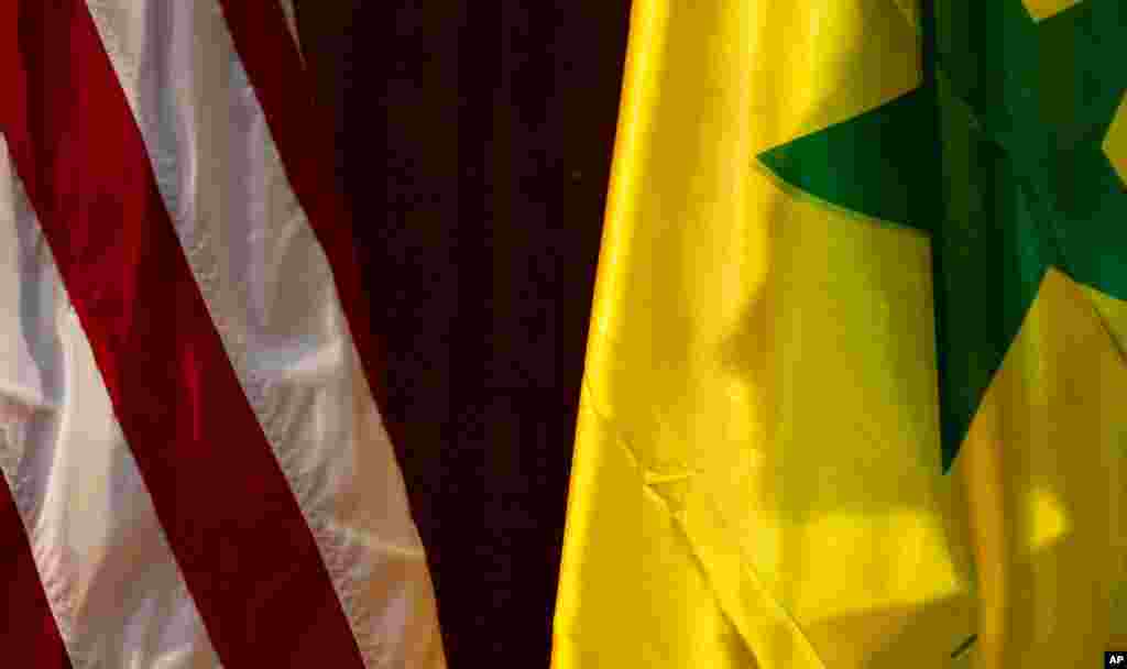 The shadow of Hillary Clinton on a Senegalese flag before she spoke at the University of Cheikh Anta Diop in Dakar, Senegal, August 1, 2012. 