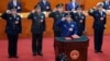 2018年3月18日，新一届中国国家中央军委大部分成员&mdash;&mdash;6位上将在北京人民大会堂宣誓就职。排名第一的副主席许其亮手抚宪法，后排从左到右：军委委员、 中央军委纪委书记兼中纪委副书记张升民，军委委员、中央军委联合参谋部参谋长李作成，军委副主席张又侠、委员、国防部长魏凤和、委员、中央军委政治工作部主任苗华。中共中央军委和国家中央军委是一套班子、两个名字、两块牌子。