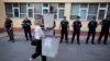 Election workers carry ballot boxes to a local election counting centre in Shkodra, Albania, June 30, 2019.