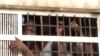 FILE - Prisoners are seen inside a truck before being transported from Kondengui Central Prison, in Yaounde, Cameroon, July 23, 2019. (Moki Edwin Kindzeka/VOA)