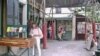 Tour guide and author Rosemary Flannery leafs through a book at Shakespeare and Company, a popular American book store in Paris. (Lisa Bryant/VOA)