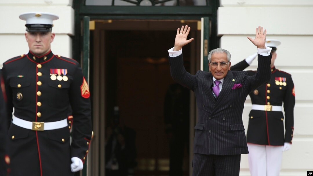 Pakistan’s Foreign Minister Tariq Fatemi waves upon arrival at the White House, March 31, 2016 in Washington, during the nuclear security summit. Fatemi is back to discuss anti-terrorism measures and human rights.