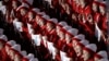 North Korean cheerleaders sing in unison before the opening ceremony of the 2018 Winter Olympics in Pyeongchang, South Korea, Friday, Feb. 9, 2018.