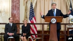 Secretary of State John Kerry, speaks during ceremony June 19, 2013, to announce winners of 2013 World Food Prize Laureate. Listening are, from left, World Food Prize Foundation Chairman John Ruan II and Janice Ruan