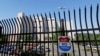 The Federal Detention Center where Blanca Orantes-Lopez is held 3,000 miles away from her child is seen behind a fence as a jet flies overhead, June 19, 2018, in SeaTac, Wash. The woman from El Salvador sits in the federal prison south of Seattle, having reported to immigration authorities after crossing the U.S.-Mexico border illegally in Texas. Her son, Abel Alexander, is in the government's custody at a children's home in Kingston, New York. She has no idea when she might see her child, one of about 2,000 children President Donald Trump's administration has taken from their parents as it cracks down on illegal immigration.