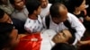 The body of Cambodian political analyst Kem Ley is carried away by his supporters to a Buddhist pagoda in Phnom Penh, Cambodia, July 10, 2016.
