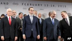 FILE - U.S. Vice President Mike Pence, PM of Poland Mateusz Morawiecki, Israeli PM Benjamin Netanyahu and U.S. Secretary of State Mike Pompeo, from left, stand on a podium at a conference on Peace and Security in the Middle East in Warsaw, Poland.