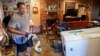 Raymond Lieteau takes photos his flood-damaged home in Baton Rouge, Louisiana, Aug. 16, 2016. Lieteau had more than five feet of water in his home. 