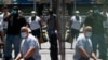 People wear masks to prevent against the spread of coronavirus disease (COVID-19), as the highly transmissible Delta variant has led to a surge in infections, in New York City, U.S., July 30, 2021. 