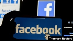 FILE PHOTO: FILE PHOTO: The Facebook logo is displayed on a mobile phone