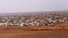 FILE - A Jordanian soldier stands guard at the northeastern border with Syria, close to the informal Rukban camp for displaced Syrians, Feb. 14, 2017.