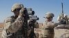FILE - U.S. soldiers surveil the area during a combined joint patrol in Manbij, Syria, Nov. 1, 2018.