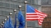 FILE - A U.S. and European Union flags are pictured during the visit of Vice President Mike Pence to European Commission headquarters in Brussels, Belgium, Feb. 20, 2017.
