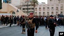 Iraqi security forces close a bridge leading to the heavily guarded Green Zone during protests demanding services and jobs in central Baghdad, Iraq, July 14, 2018.