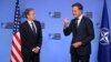 NATO's Secretary General Mark Rutte, right, gestures as he speaks with U.S. Secretary of State Antony Blinken during a NATO Foreign Ministers' meeting at the NATO headquarters in Brussels, on Dec. 3, 2024.