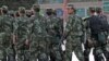Armed police officers patrol an ethnice Uighur area in Kashgar, Xinjiang province, Aug. 4, 2011.