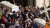 Relatives and friends carry the coffins of brothers Nadi Yousef Shehata, right, and Reda Yousef Shehata, two of the seven victims of an Islamic State ambush, in Minya, Egypt, Nov. 3, 2018.