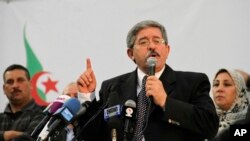 FILE - Algerian Prime Minister Ahmed Ouyahia speaks during a meeting the National Democratic Rally in Algiers, May 5, 2012. 