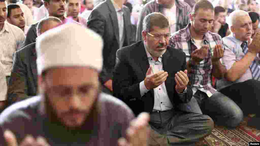 Muslim Brotherhood's presidential candidate Mohamed Morsi attends Friday prayers at a mosque in Cairo.