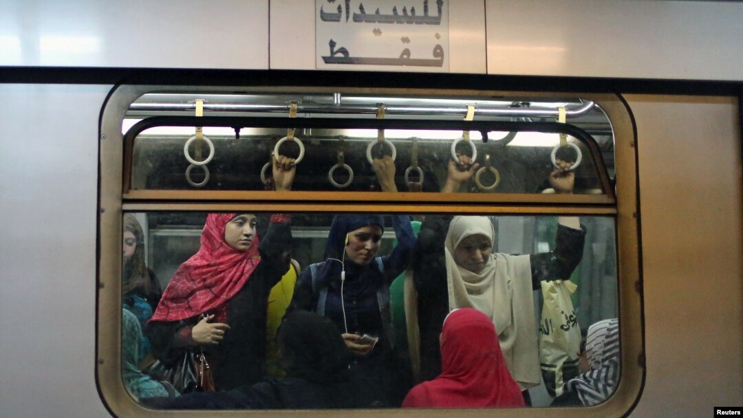 Commuters are seen inside the metro at Sadat metro station underneath Tahrir Square in Cairo, Egypt, June 17, 2015.