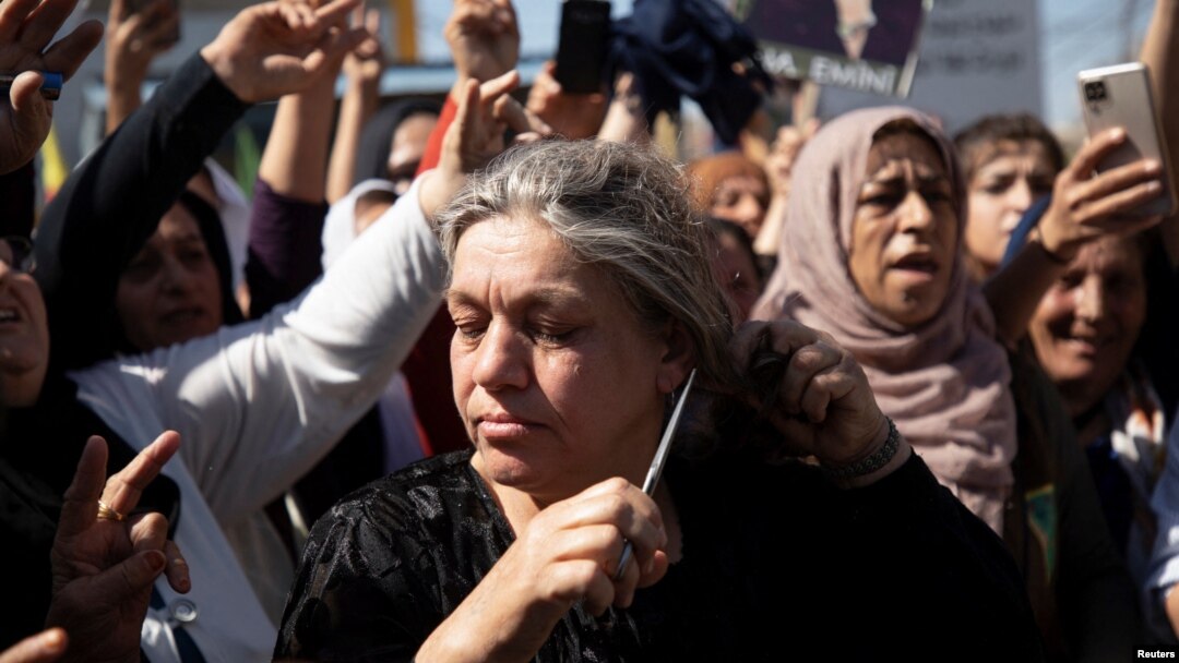 Women protest over the death of Mahsa Amini in Iran, in the Kurdish-controlled city of Qamishli