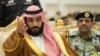 Saudi Crown Prince Mohammed bin Salman gestures during a military parade by Saudi security forces in Mecca, Saudi Arabia, Aug. 23, 2017.