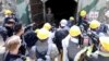 Journalists look around the third tunnel of Punggye-ri nuclear test ground before it is blown up during the dismantlement process in Punggye-ri, North Hamgyong Province, North Korea, May 24, 2018.
