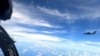A plane with a Chinese flag on its tail is seen in this handout picture, June 2, 2021.