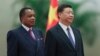 Chinese President Xi Jinping, right, and Congo President Denis Sassou Nguesso listen to their national anthems during a welcoming ceremony inside the Great Hall of the People in Beijing, Sept. 5, 2018.
