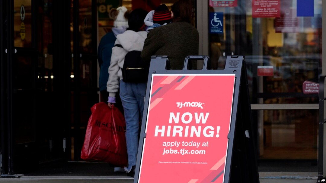 Hiring sign is displayed outside of a retail store in Vernon Hills, Ill., Nov. 13, 2021.