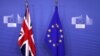 British and EU flags are seen before Britain's Prime Minister Theresa May meets with Commission President Jean-Claude Juncker to discuss draft agreements on Brexit, at the EC headquarters in Brussels, Belgium, Nov. 21, 2018. 