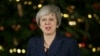 British Prime Minister Theresa May makes a statement outside 10 Downing Street, in London, Dec. 12, 2018. British Prime Minister Theresa May survived a brush with political mortality Wednesday, winning a no-confidence vote of her Conservative lawmakers.