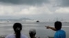 FILE - A tourist points China's Xiamen from a former military fort, ahead of the 60th anniversary of Second Taiwan Straits Crisis against China, on Lieyu island, Kinmen county, Taiwan, Aug. 20, 2018. 