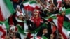 Iranian women cheer during a soccer match between their national team and Cambodia in the 2022 World Cup qualifier at the Azadi (Freedom) Stadium in Tehran, Iran, Oct. 10, 2019. Iranian women were allowed into the stadium for the first time in decades.