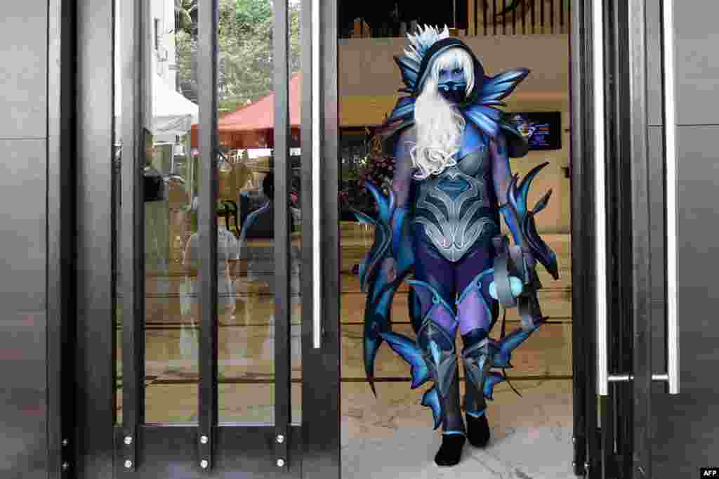 A person dressed as Japanese anime character Traxex, the Drow Ranger, arrives to take part in the annual 'Planet Cosplay Walk 2019' event, in Bangalore, India, on March 24, 2019.