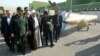 Iraq's President Barham Salih walks with Iranian President Hassan Rouhani during a welcome ceremony at Salam Palace in Baghdad, Iraq, March 11, 2019.