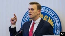 Russian opposition leader Alexei Navalny, who submitted endorsement papers necessary for his registration as a presidential candidate, speaks at the Russia's Central Election commission in Moscow, Dec. 25, 2017.