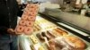 FILE - In this April 26, 2011 file photo, doughnuts are displayed in Chicago.