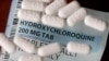 FILE - This Monday, April 6, 2020, file photo shows an arrangement of Hydroxychloroquine pills in Las Vegas. At least 13 states have obtained a total of more than 10 million doses of malaria drugs to treat COVID-19 patients despite warnings from…