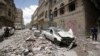 People inspect the site of an airstrike by Saudi-led coalition in Sanaa, Yemen, May, 16, 2019. 