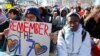 FILE - Students sit in silence as they rally in front of the White House in Washington, March 14, 2018. 