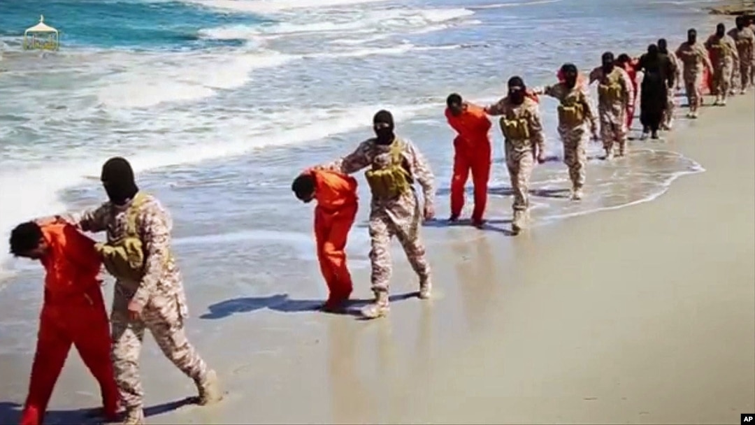 This undated image made from video released by Islamic State militants April 19, 2015, purports to show a group of captured Ethiopian Christians taken to a beach before being executed.