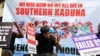 FILE -: People gather to protest the incessant killings in southern Kaduna and insecurities in Nigeria, at the U.S. embassy in Abuja, Nigeria, August 15, 2020.