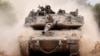An Israeli army tank drives into position near Israel's southern border with the Gaza Strip on Dec. 11, 2024.