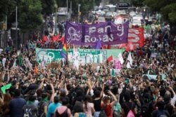 Women take part in a protest, part of a movement known as "Marea Verde," to mark the International Safe Abortion Day in Mexico City, Sept. 28, 2019.