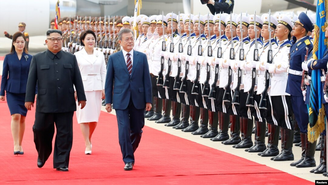 South Korean President Moon Jae-in and North Korean leader Kim Jong Un attend an official welcome ceremony at Pyongyang Sunan International Airport, in Pyongyang, North Korea, September 18, 2018.