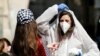 A teenager wears a costume as a reference to the coronavirus during the Jewish holiday of Purim, Jerusalem March 8, 2020.
