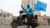 Abukar Ahmed celebrates the ruling by the International Court of Justice, largely in favor of Somalia in its dispute with Kenya, setting a sea boundary in part of the Indian Ocean in Mogadishu, Somalia, Oct. 12, 2021. 
